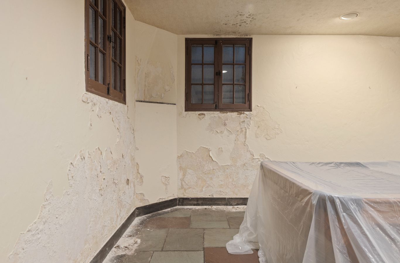 Loft Drywall & Plaster team member blending repaired wall texture in Sewickley, PA for a smooth, consistent finish.